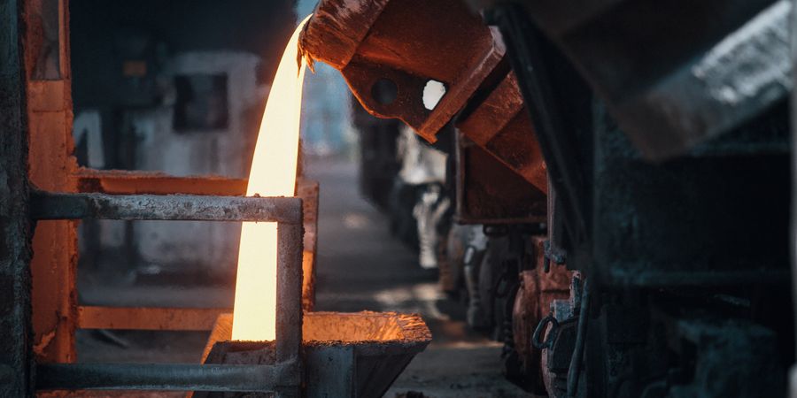 Molten metal being poured in a foundry — the kind of continuous high-temperature, high-abrasion duty where brick working linings outlast castable and fiber